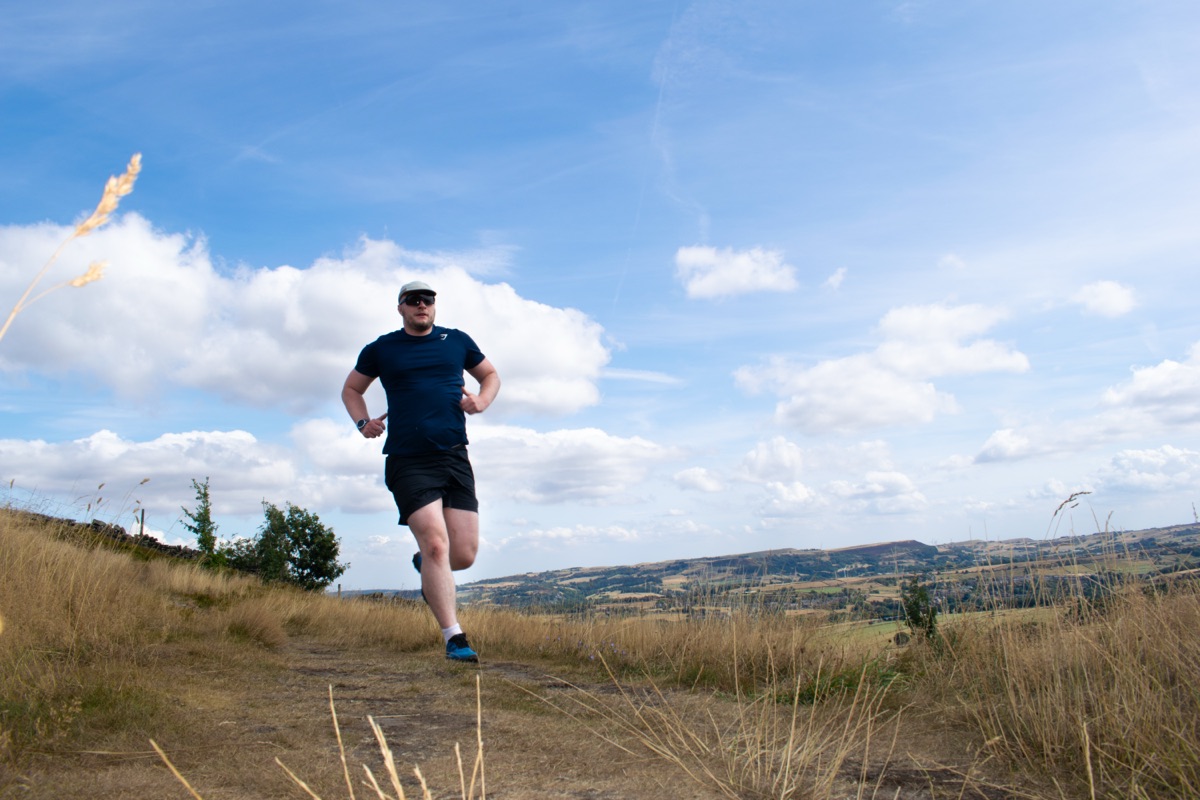 Shea running across open moorland